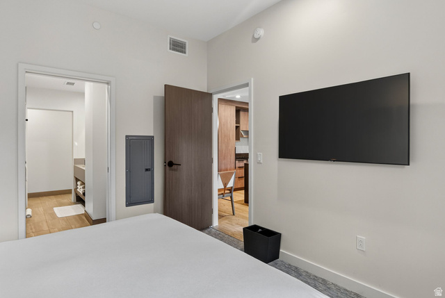 2417 West High Road, Unit 3210 Park City, UT 84098 - Photo 25 of 44 Second bedroom with a mounted television and a doorway to its ensuite bath at Pendry Park City.