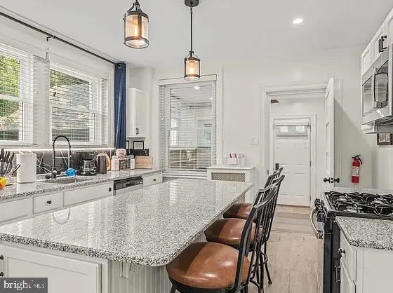 a dining table with chairs and window