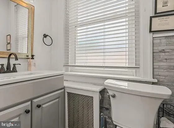 a bathroom with a sink and a toilet
