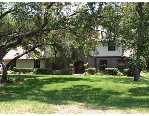 6719 Ridge Top Drive New Port Richey, FL 34655 - Photo 1 of 1 a view of a house with a yard and sitting area