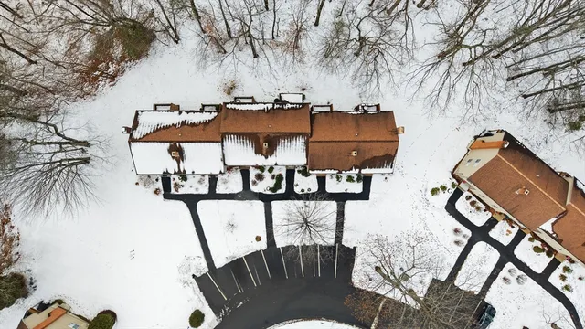 a view of a swimming pool with a table and chairs