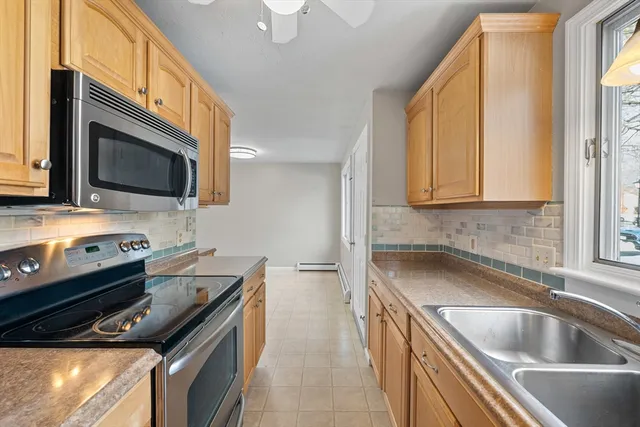 a kitchen that has a sink and a stove