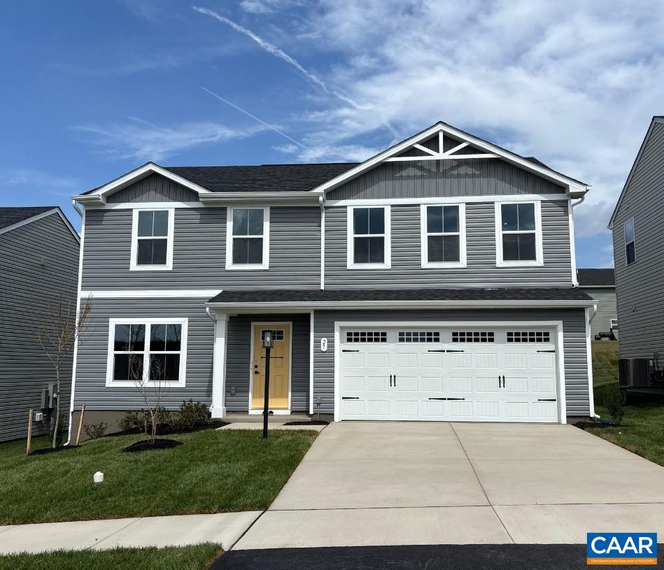 27 Everglades Road Barboursville, VA 22923 - Photo 1 of 25 a front view of a house with a yard and garage