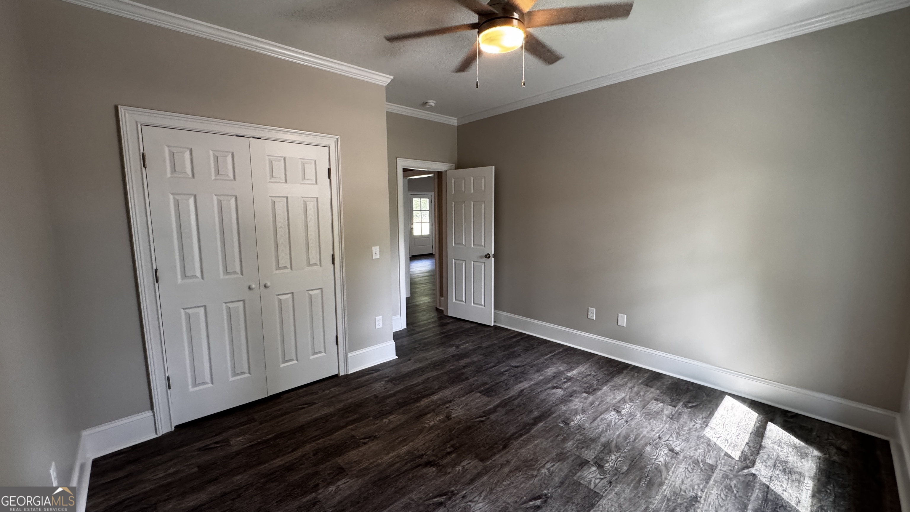 3 Willow Pointe Claxton, GA 30417 - Photo 19 of 31 an empty room with wooden floor and fan