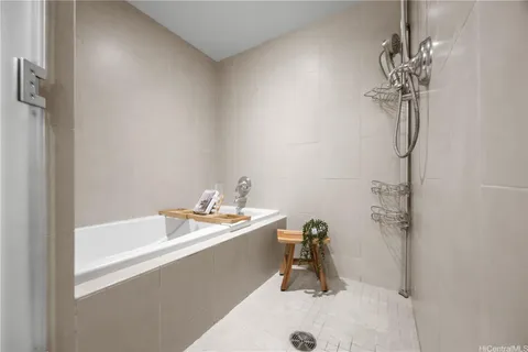 a bathroom with a sink a mirror and a shower