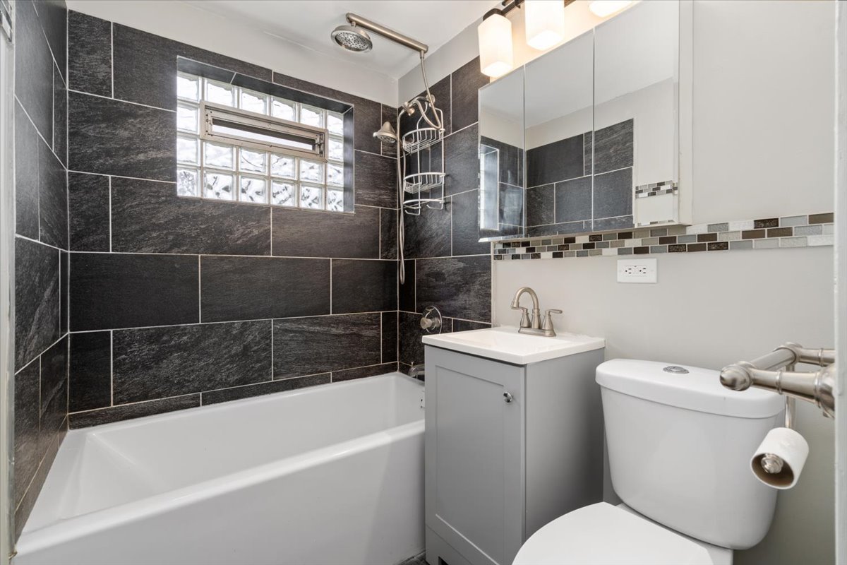 3923 Madison Avenue Brookfield, IL 60513 - Photo 20 of 26 a bathroom with a sink toilet and shower