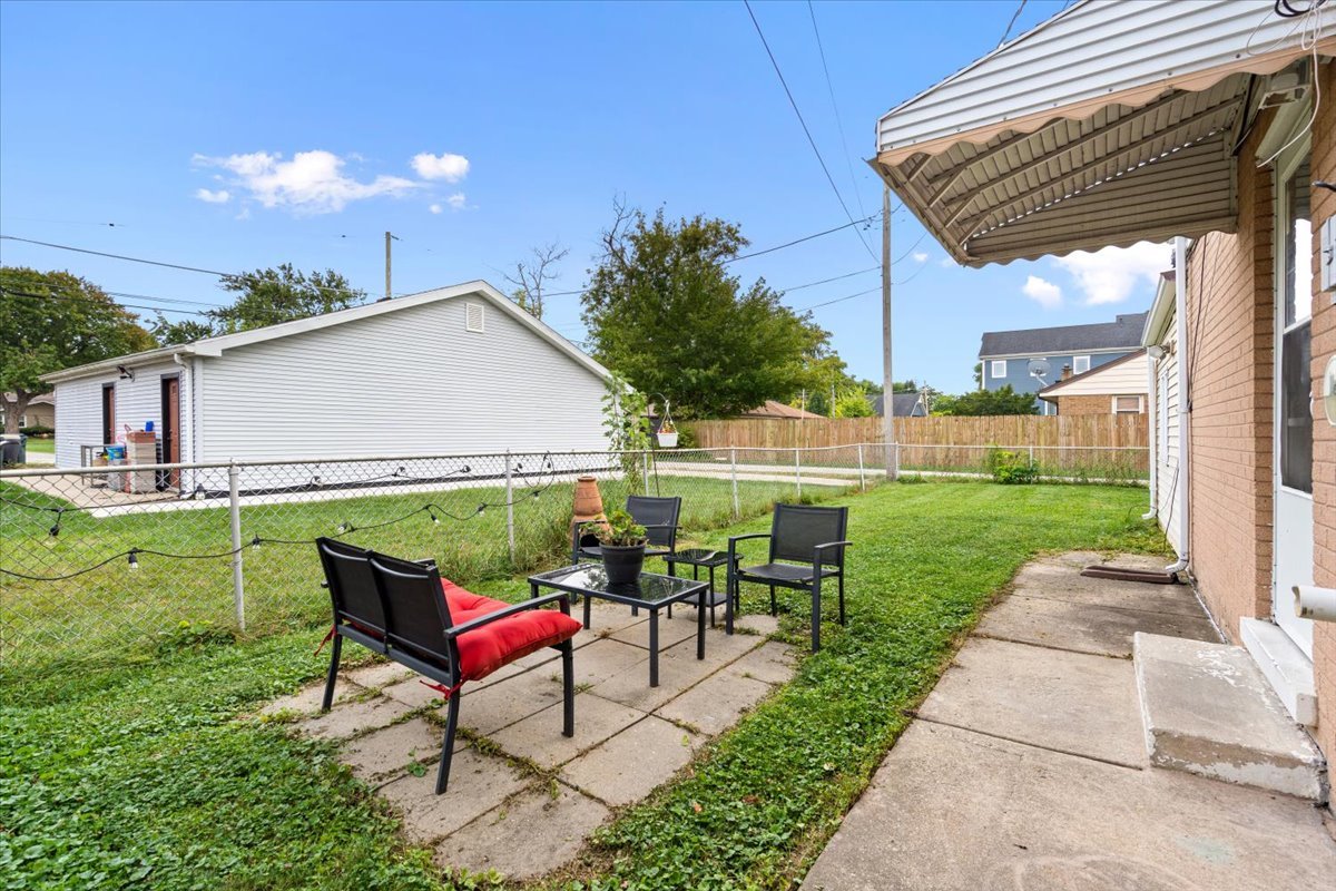 3923 Madison Avenue Brookfield, IL 60513 - Photo 26 of 26 a view of a house with backyard sitting area and garden