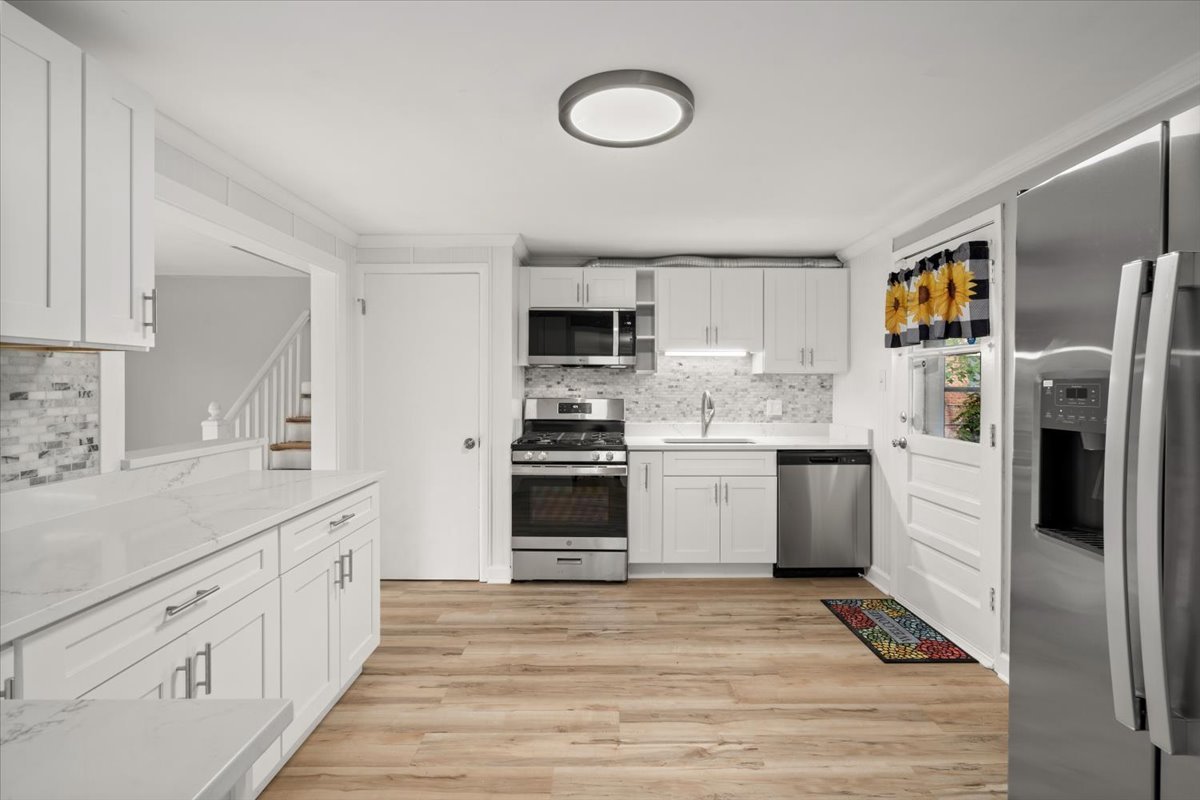 3923 Madison Avenue Brookfield, IL 60513 - Photo 9 of 26 a kitchen with granite countertop a refrigerator stove top oven and sink