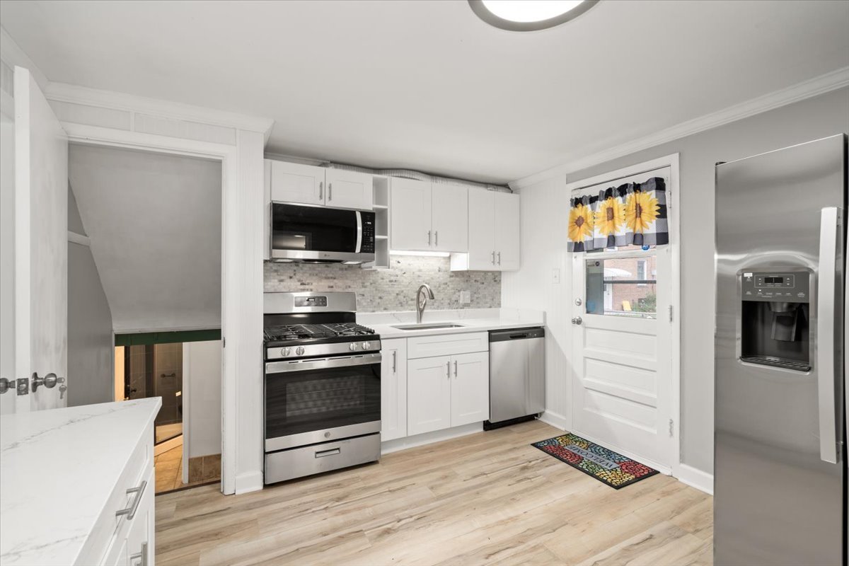 3923 Madison Avenue Brookfield, IL 60513 - Photo 10 of 26 a kitchen with a stove and a microwave