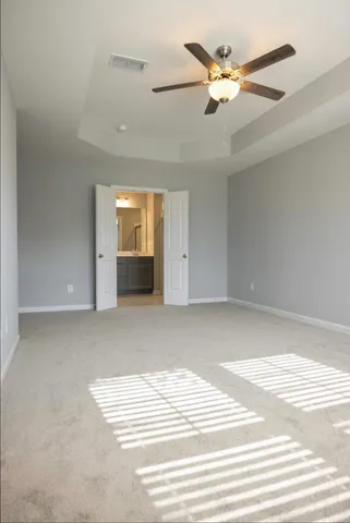 a bathroom with a shower sink and mirror