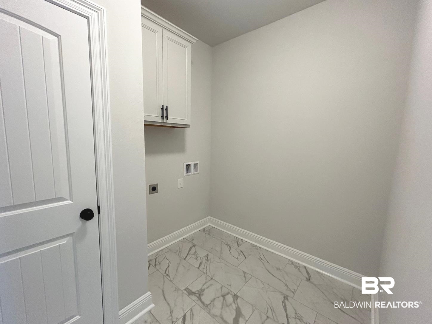 880 Sumter Loop Foley, AL 36535 - Photo 7 of 14 Laundry area featuring washer hookup, hookup for an electric dryer, and cabinets