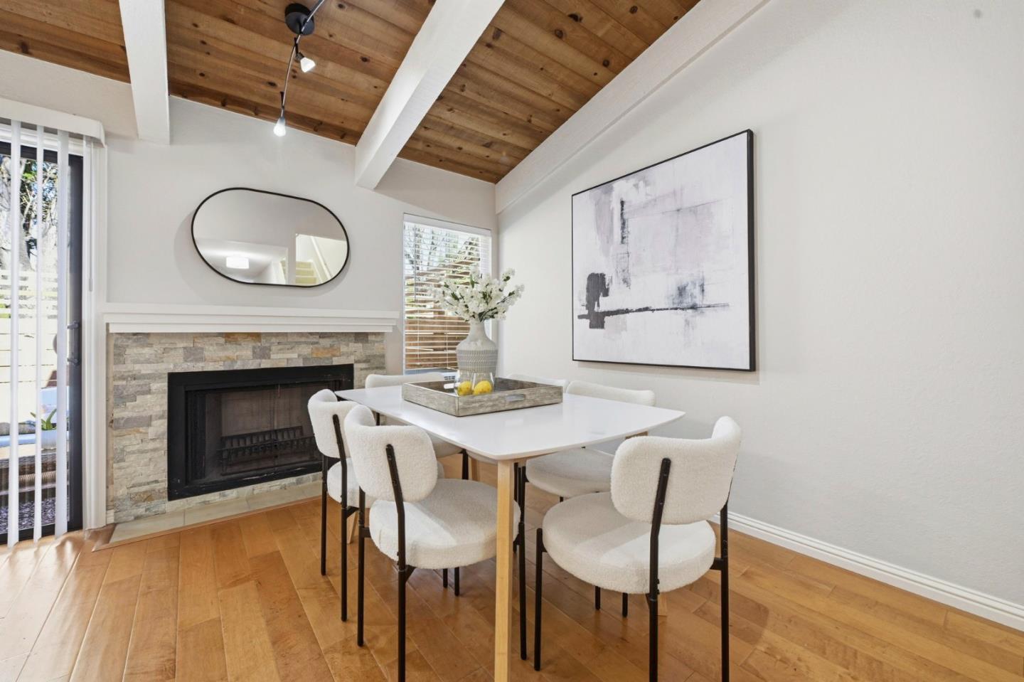 751 West Middlefield Road, Unit C Mountain View, CA 94043 - Photo 11 of 27 a dining room with furniture and a fireplace