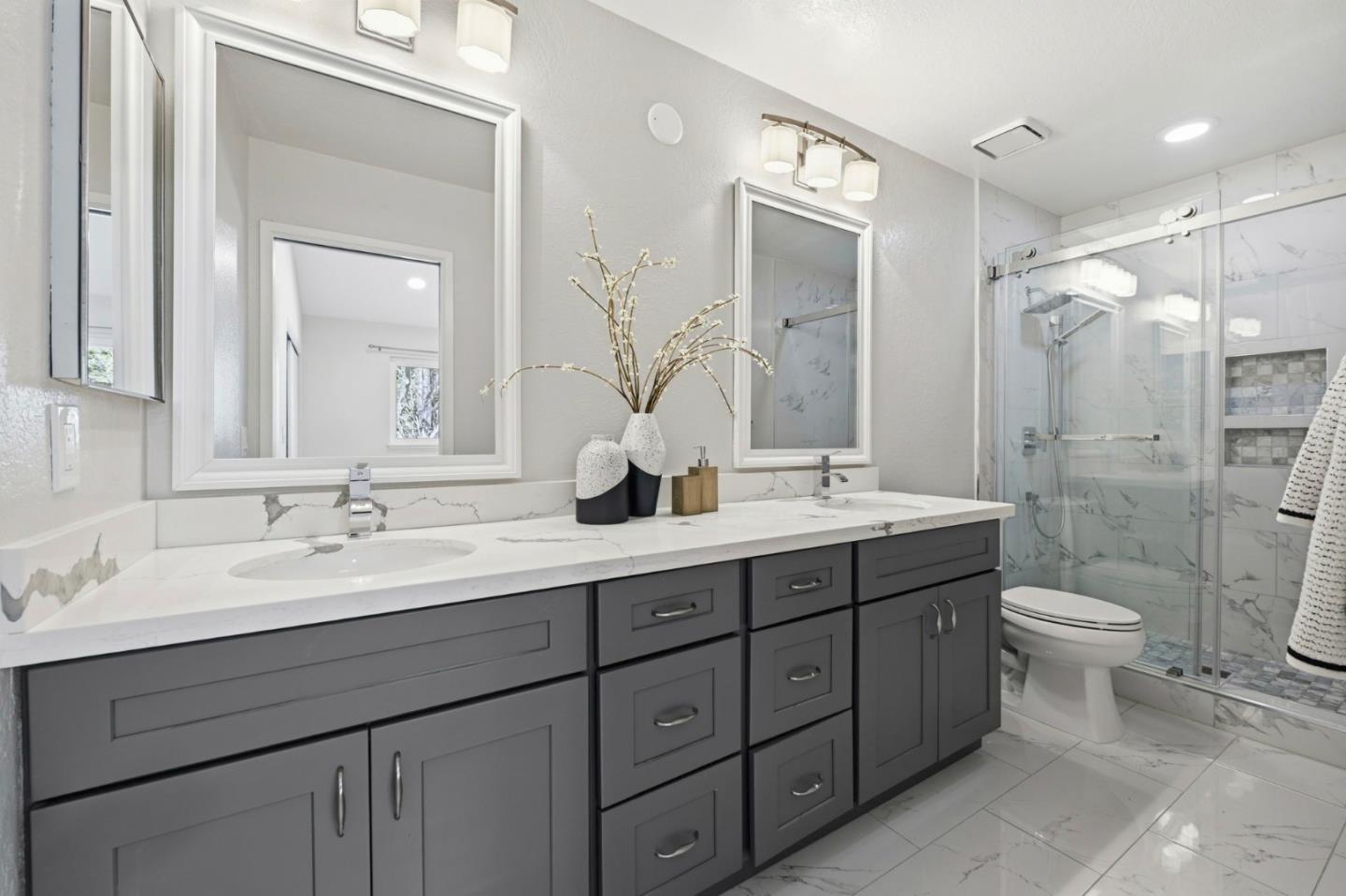 751 West Middlefield Road, Unit C Mountain View, CA 94043 - Photo 18 of 27 a bathroom with a double vanity sink toilet and shower