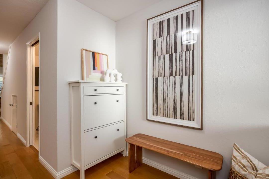 751 West Middlefield Road, Unit C Mountain View, CA 94043 - Photo 4 of 27 a hallway with a dresser and a window