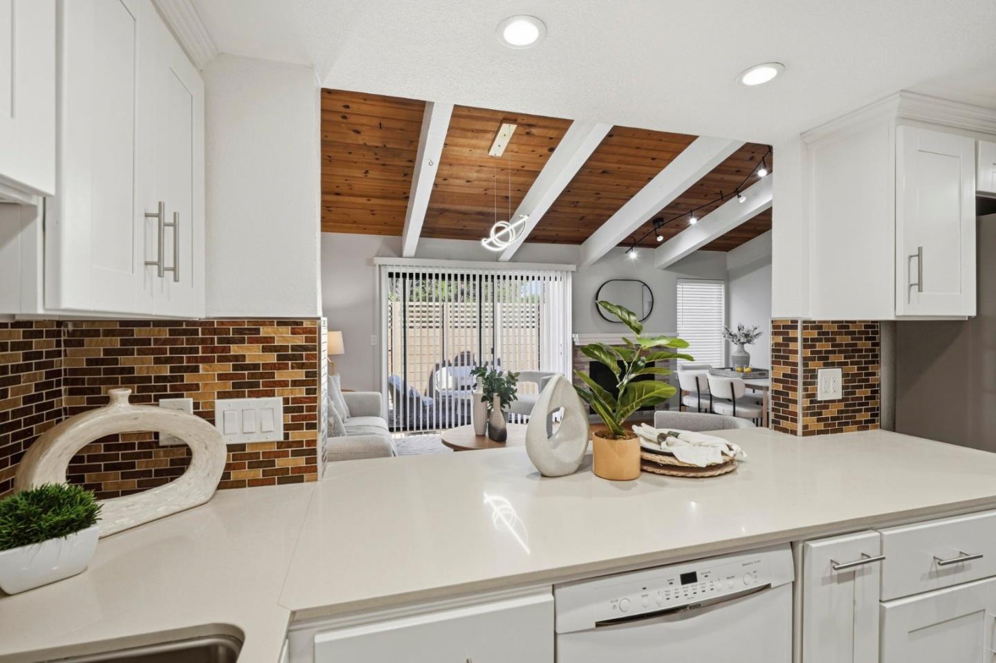 751 West Middlefield Road, Unit C Mountain View, CA 94043 - Photo 9 of 27 a kitchen with a stove and a white cabinets