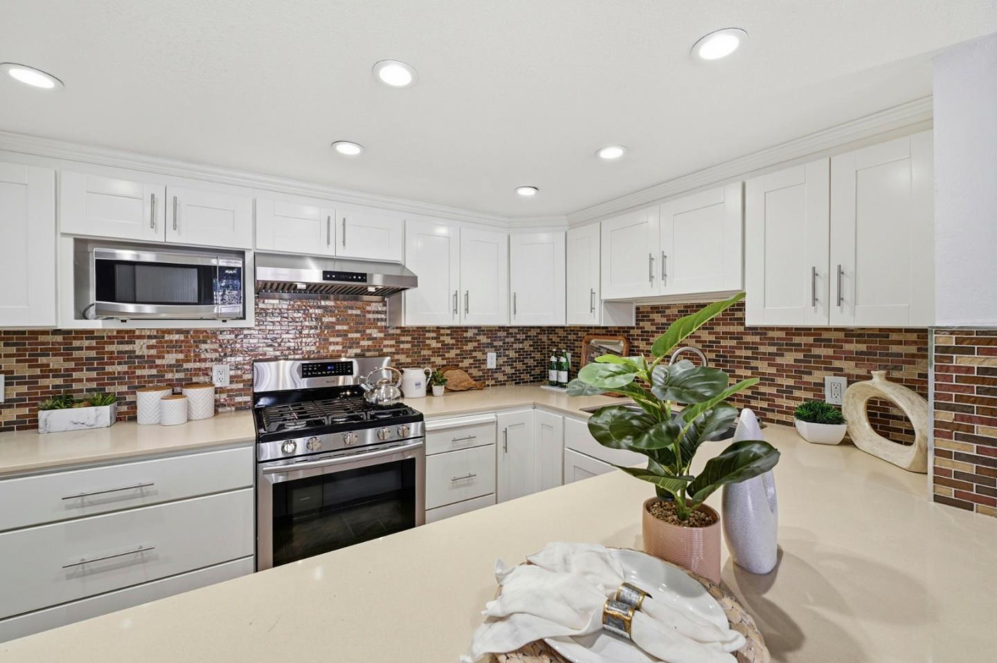 751 West Middlefield Road, Unit C Mountain View, CA 94043 - Photo 10 of 27 a kitchen with granite countertop a sink stainless steel appliances and cabinets
