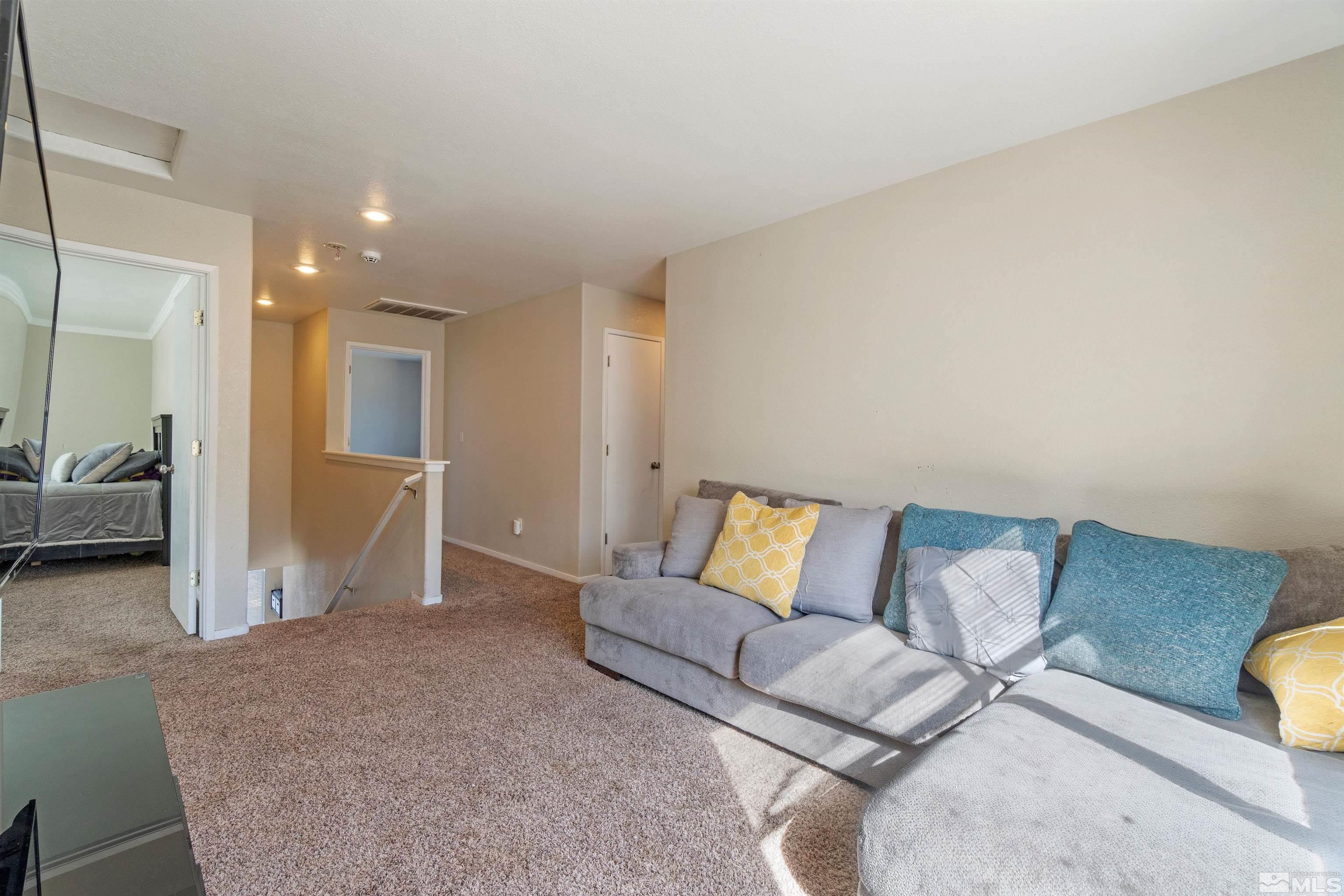 8707 Malibu Drive Reno, NV 89506 - Photo 20 of 35 a living room with furniture and a couch