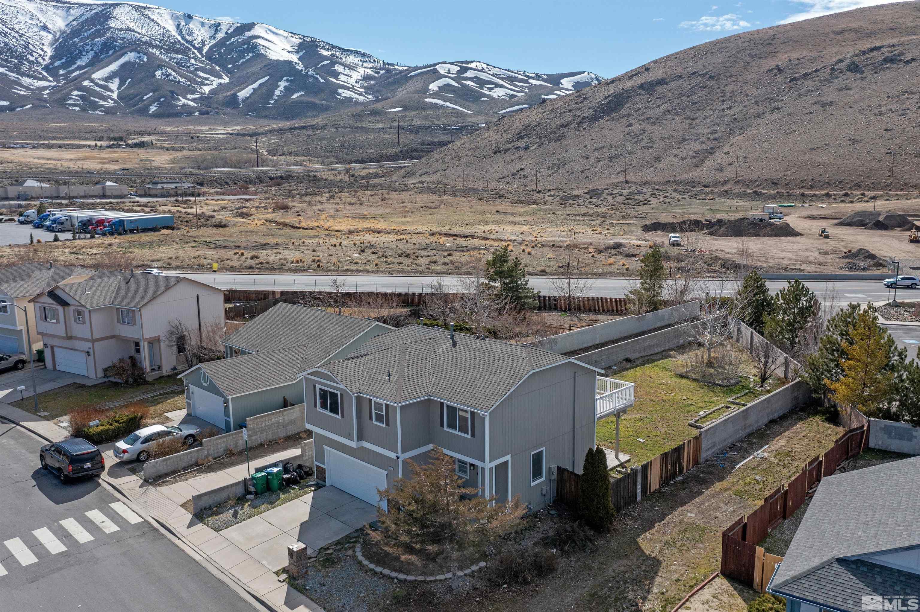 8707 Malibu Drive Reno, NV 89506 - Photo 2 of 35 an aerial view of residential houses with outdoor space