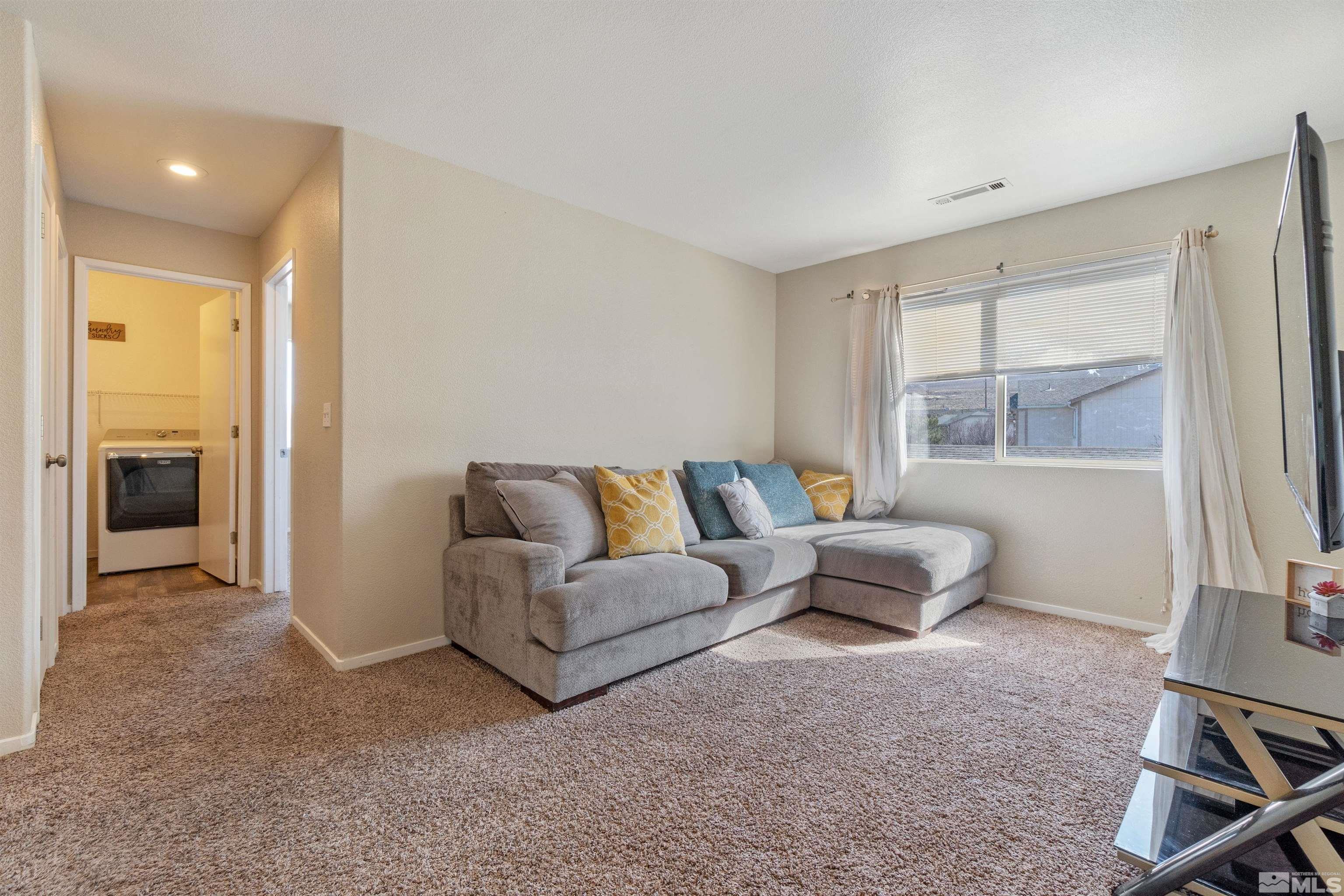 8707 Malibu Drive Reno, NV 89506 - Photo 22 of 35 a living room with furniture and a window