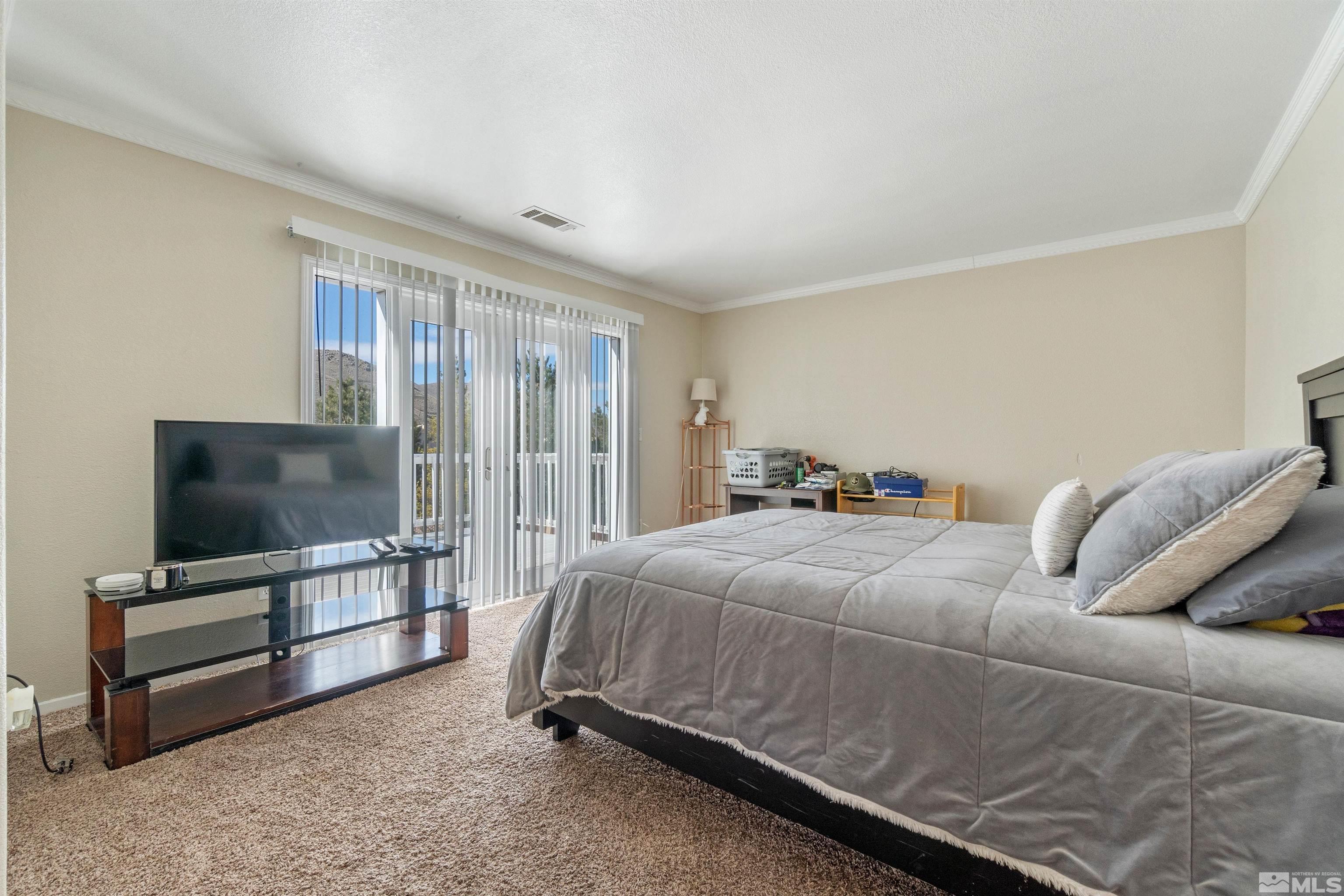 8707 Malibu Drive Reno, NV 89506 - Photo 23 of 35 a living room with furniture and a flat screen tv
