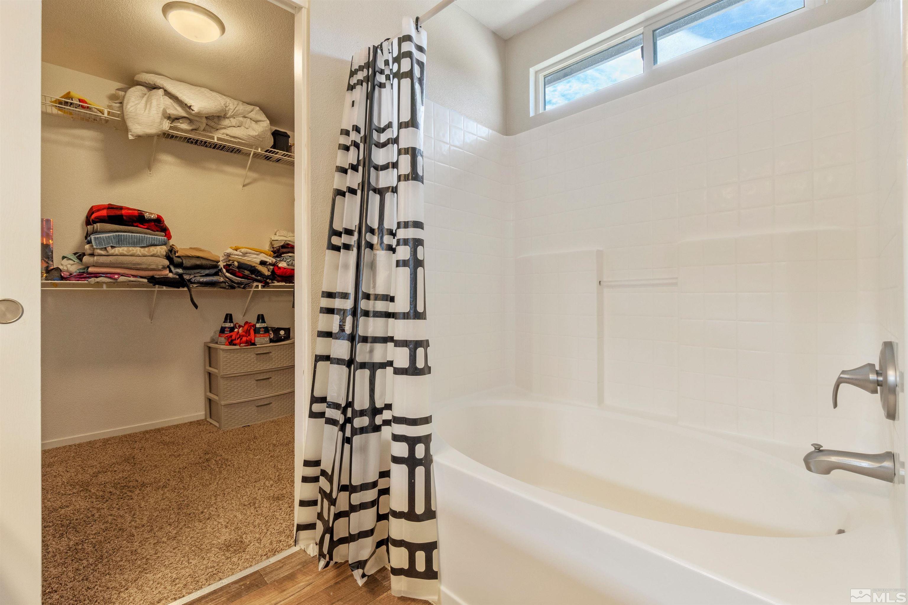 8707 Malibu Drive Reno, NV 89506 - Photo 26 of 35 a bathroom with a bathtub and shower