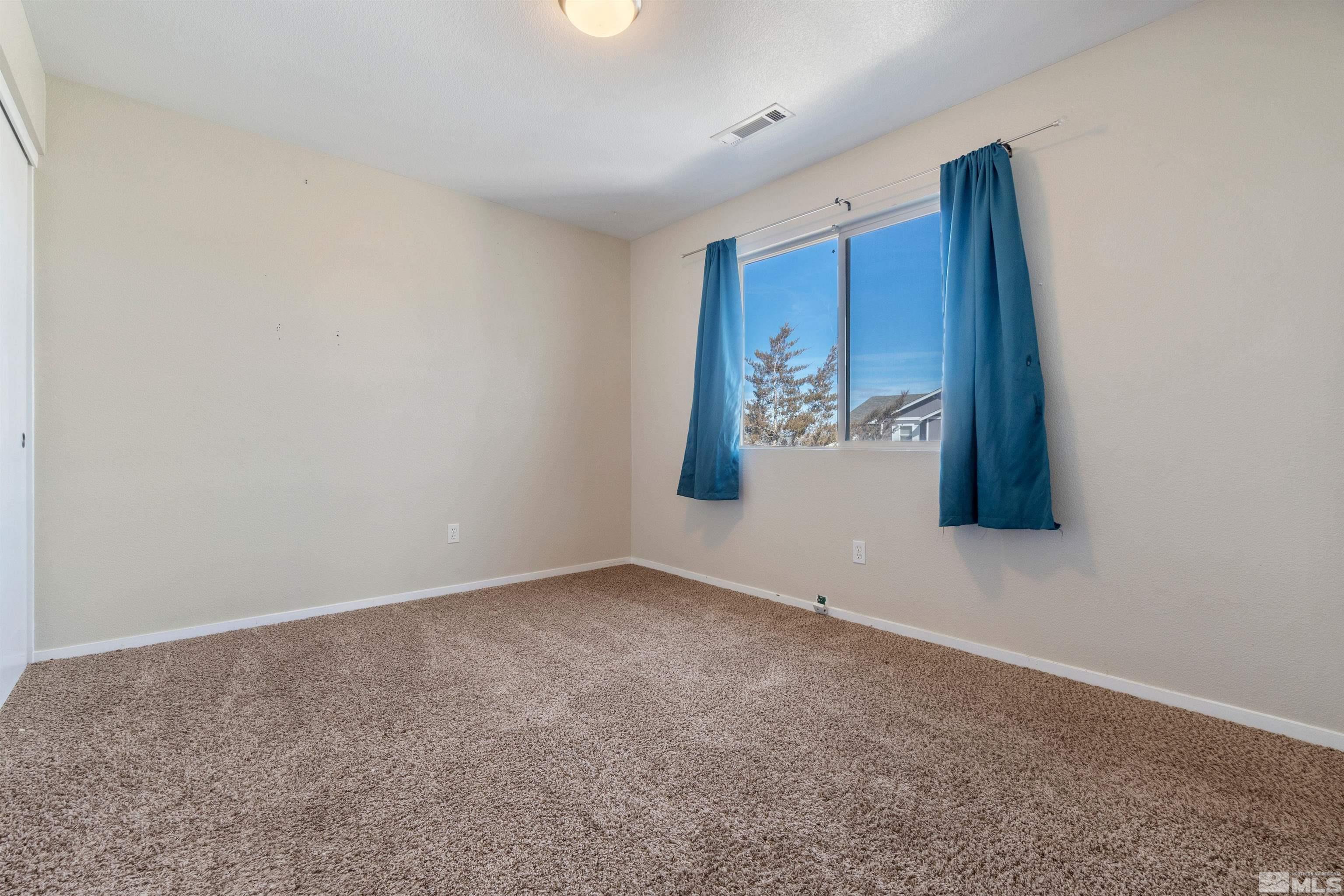8707 Malibu Drive Reno, NV 89506 - Photo 28 of 35 an empty room with windows