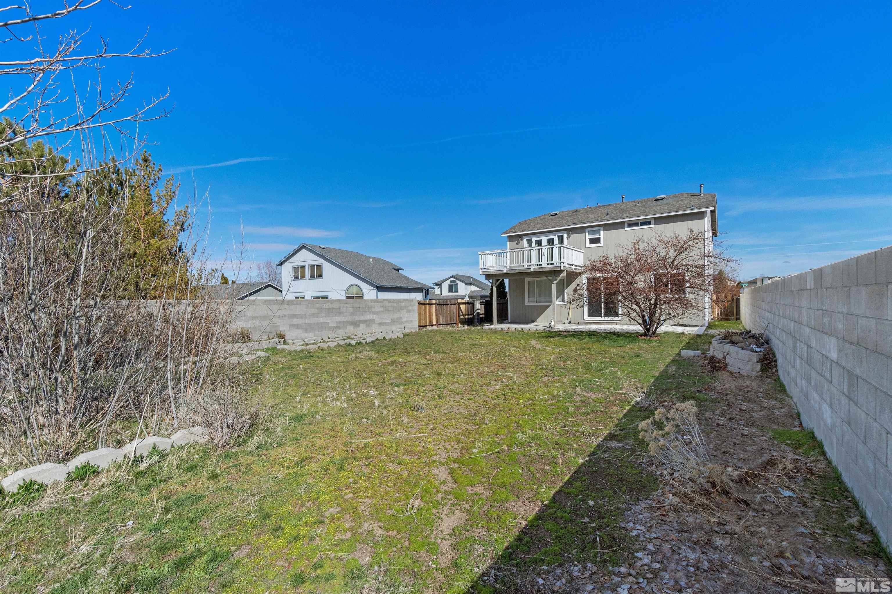 8707 Malibu Drive Reno, NV 89506 - Photo 33 of 35 a view of a house with a yard