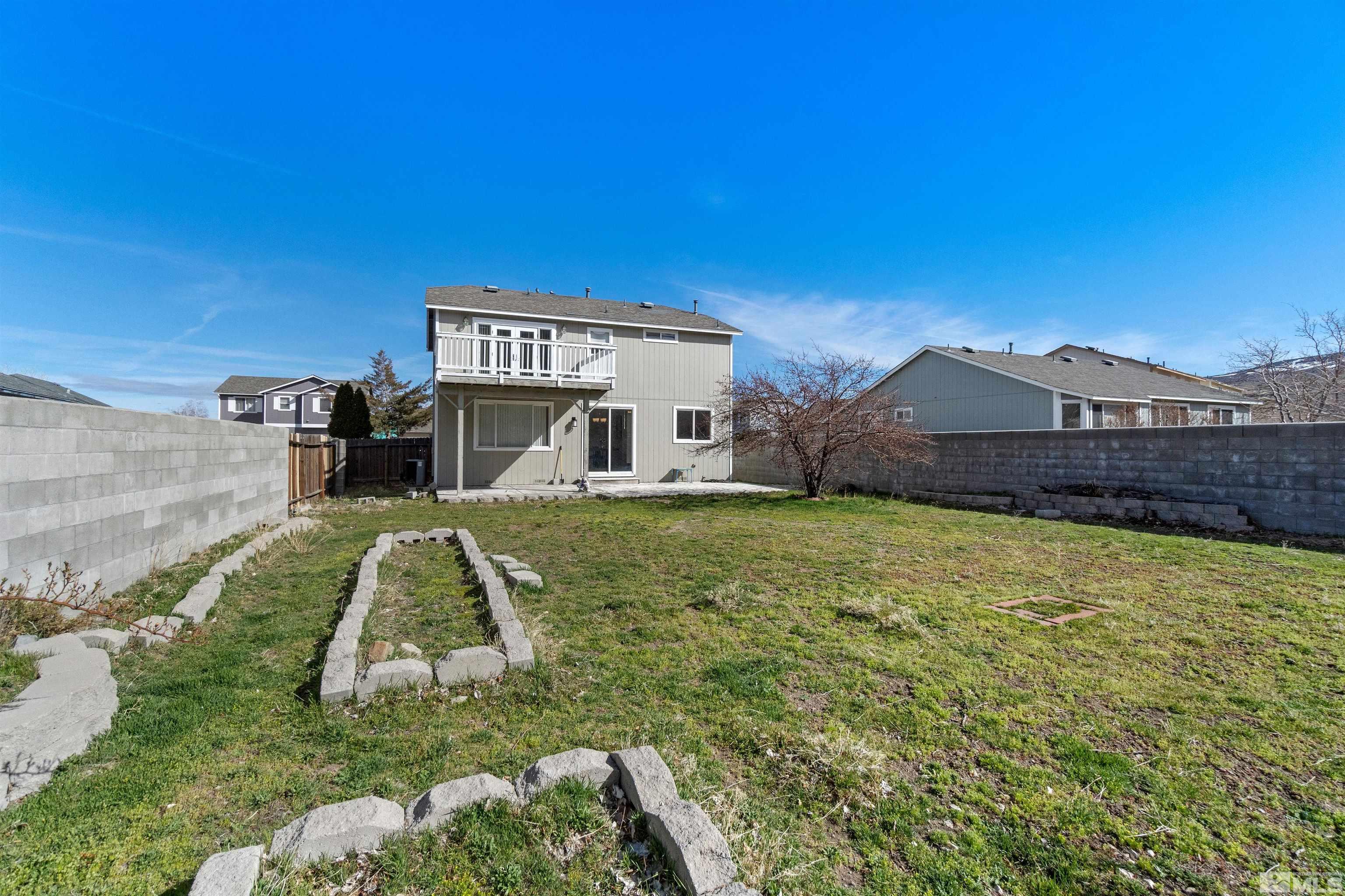8707 Malibu Drive Reno, NV 89506 - Photo 34 of 35 a view of a house with a yard
