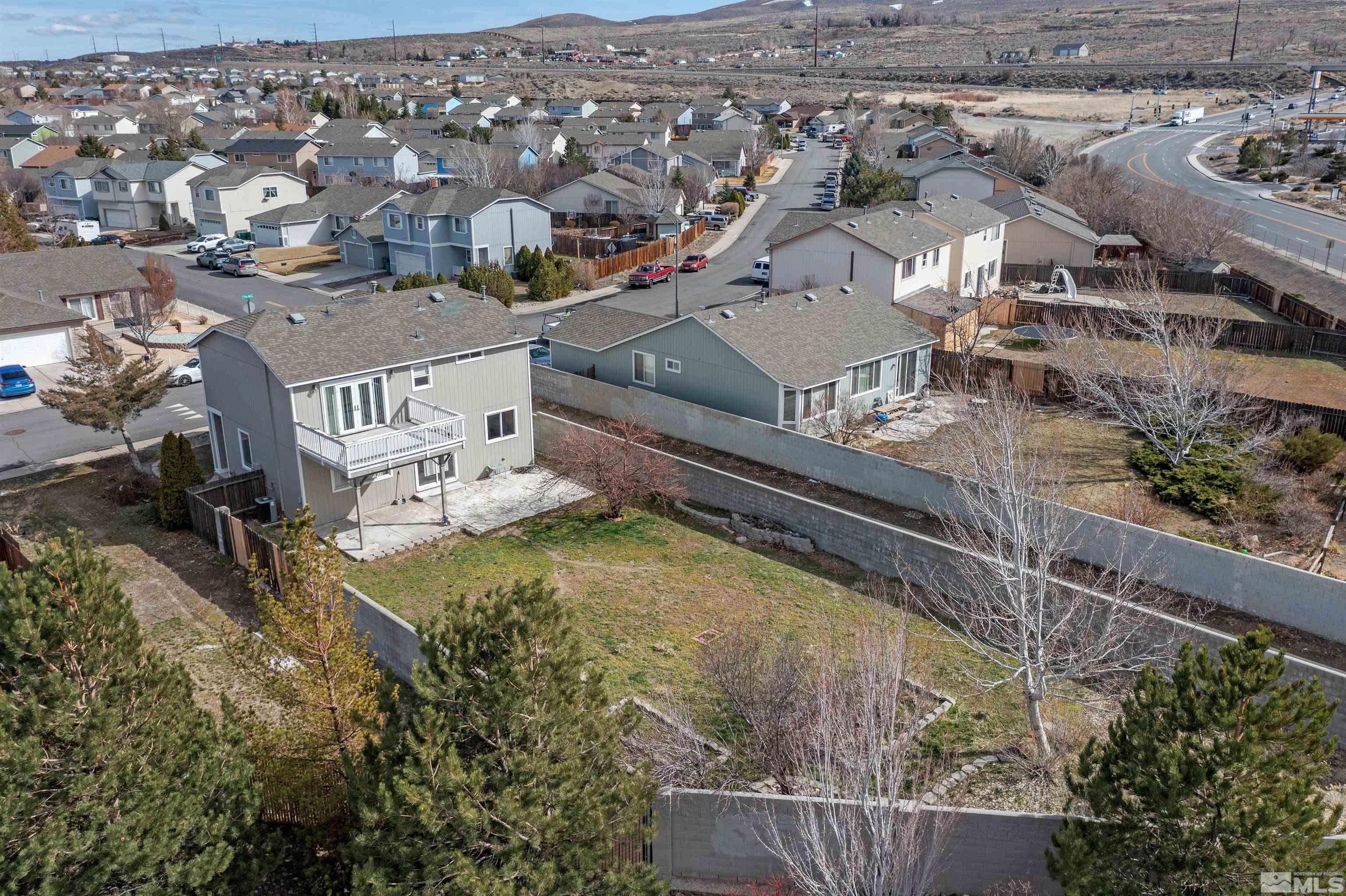 8707 Malibu Drive Reno, NV 89506 - Photo 35 of 35 an aerial view of residential houses with outdoor space