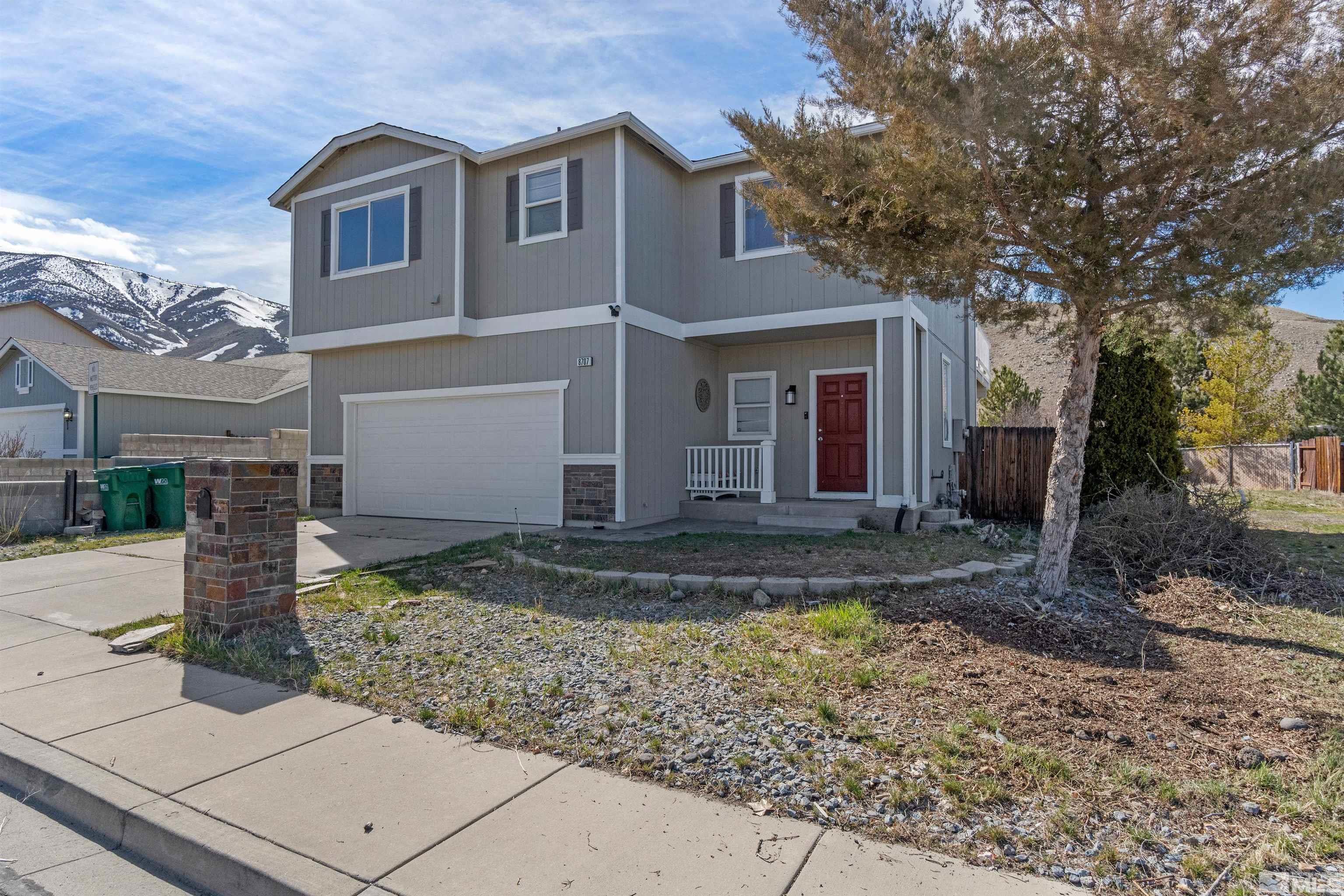 8707 Malibu Drive Reno, NV 89506 - Photo 4 of 35 a front view of house with yard