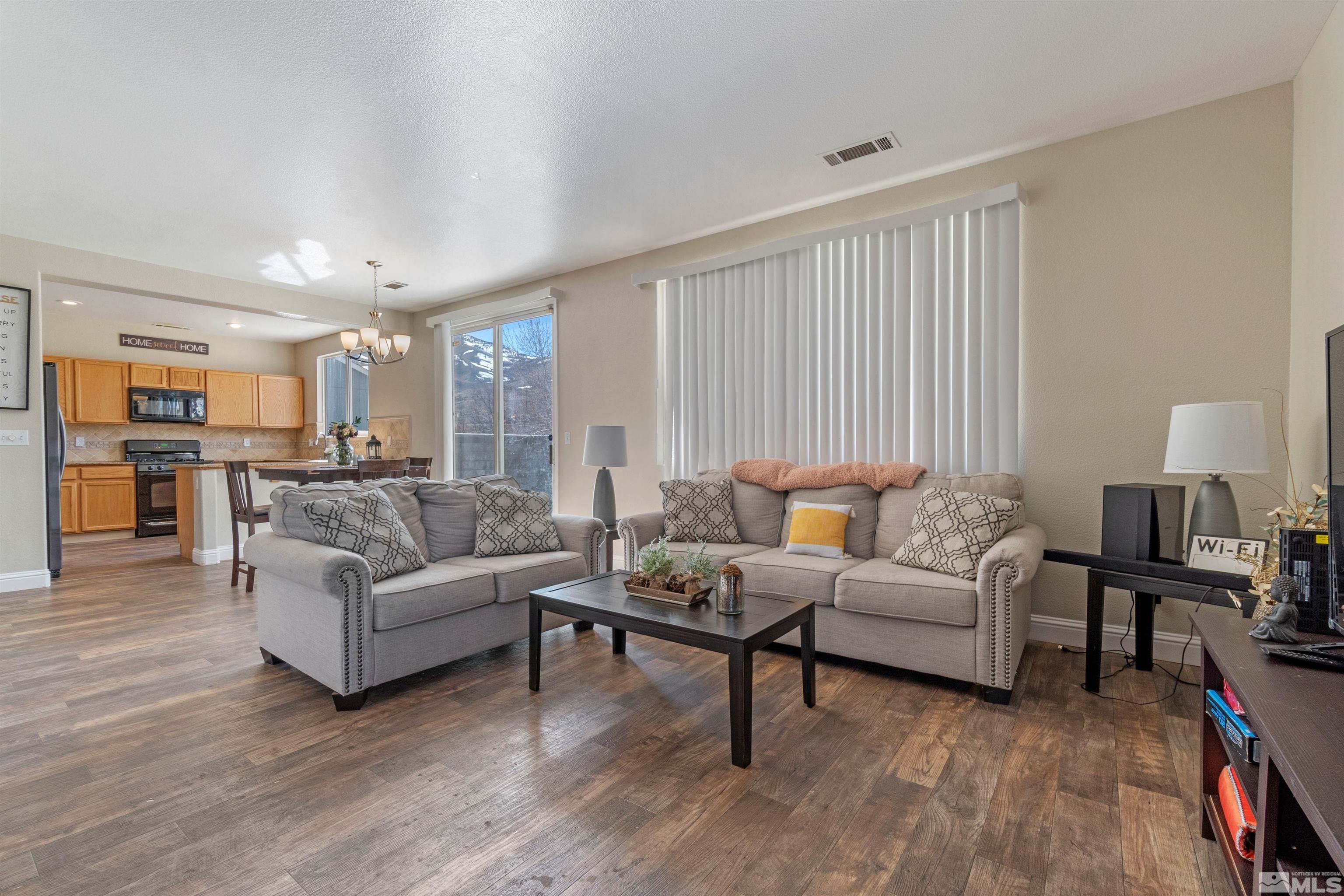 8707 Malibu Drive Reno, NV 89506 - Photo 5 of 35 a living room with furniture and a wooden floor