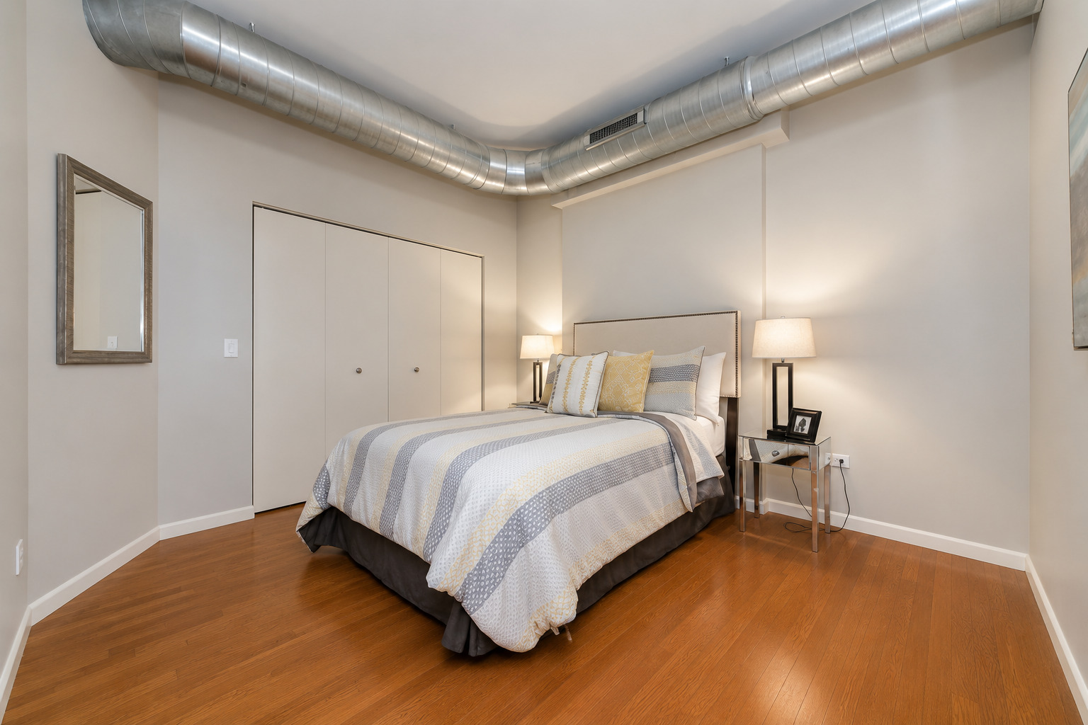 1200 West Monroe Street, Unit 502 Chicago, IL 60607 - Photo 13 of 20 a bedroom with a bed and a table