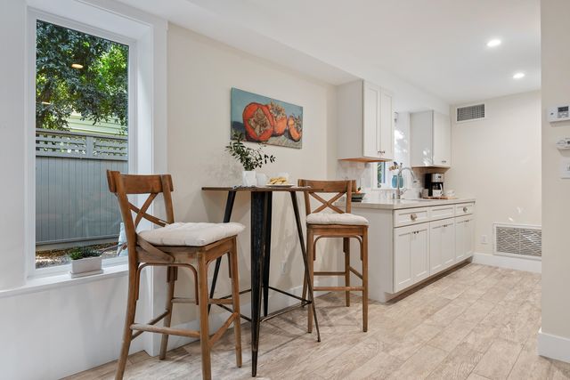 a view of a dining room with furniture and window