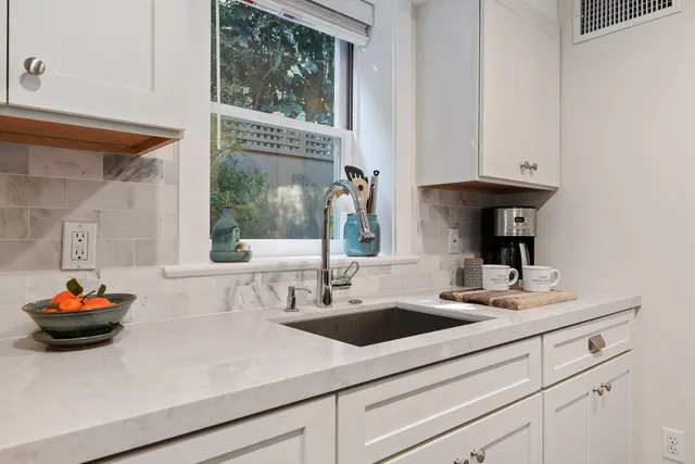 a kitchen with a sink and a window