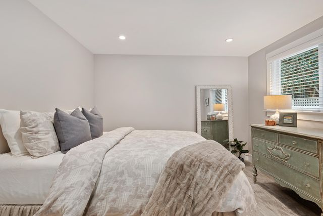 a bedroom with a bed and a table in it