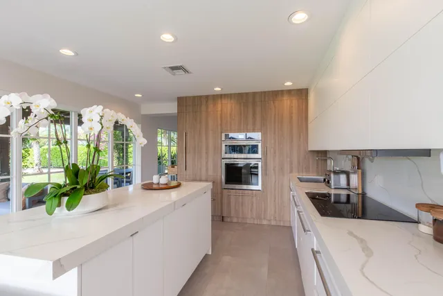a kitchen with counter top space cabinets and stainless steel appliances