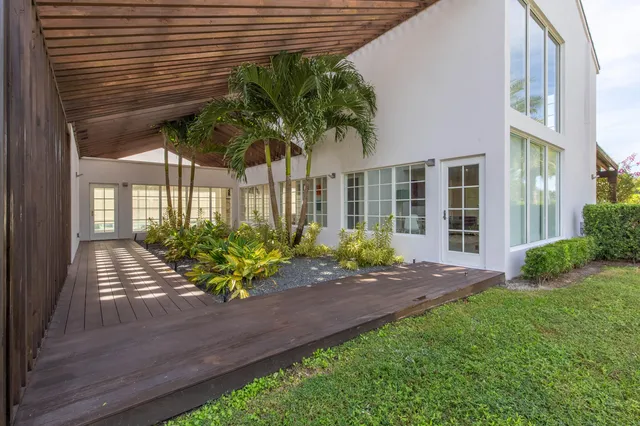 a view of a house with a yard and garden