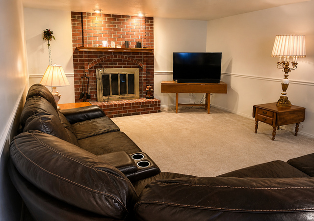 1020 Wilmar Place Centerville, UT 84014 - Photo 12 of 22 Living area featuring a brick fireplace a wood mantel, and overhead lighting