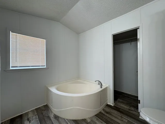 a white bath tub sitting in a bathroom