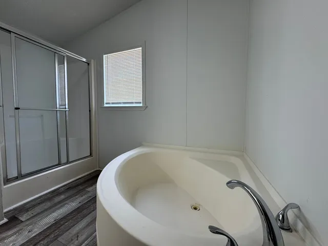 a white bath tub sitting in a bathroom