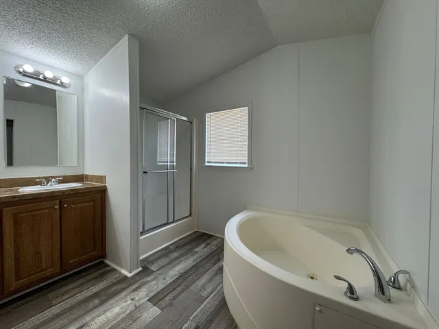 a bathroom with a bathtub and a sink