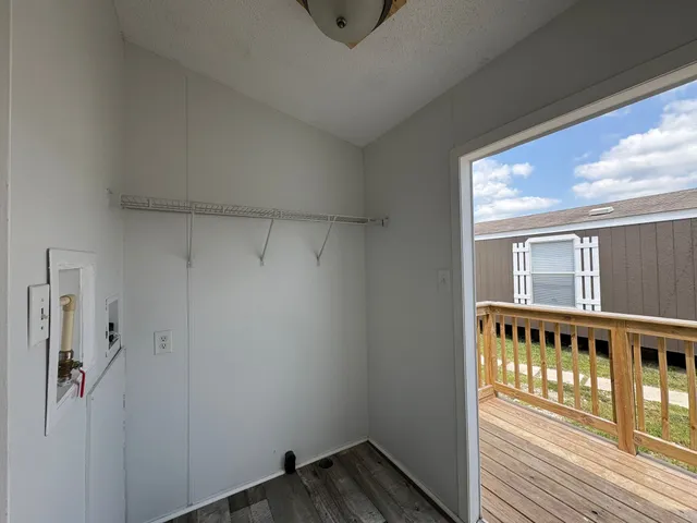 a view of a porch with wooden floor