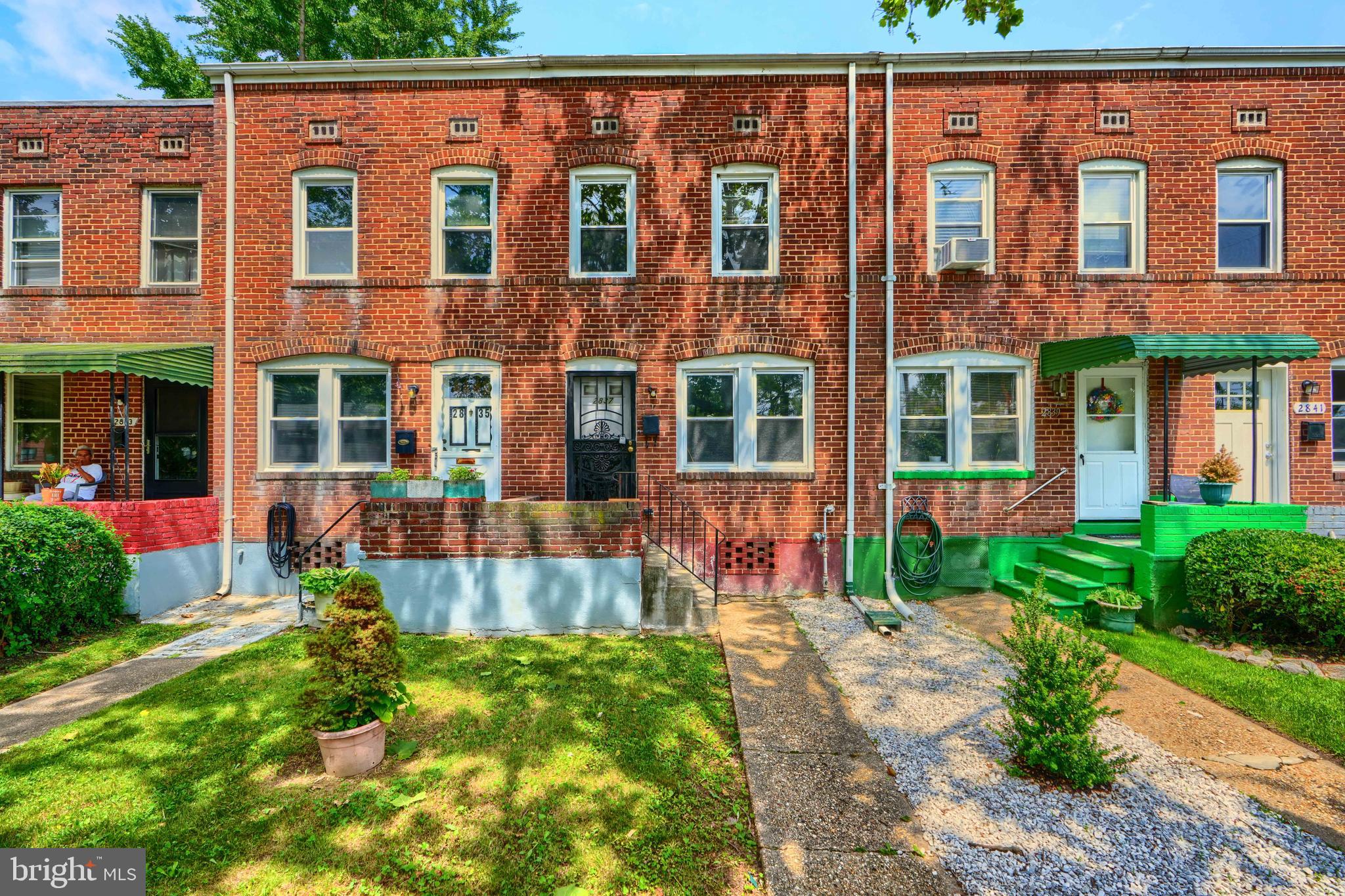 2837 Round Road Baltimore, MD 21225 - Photo 1 of 18 front view of a brick building with a yard