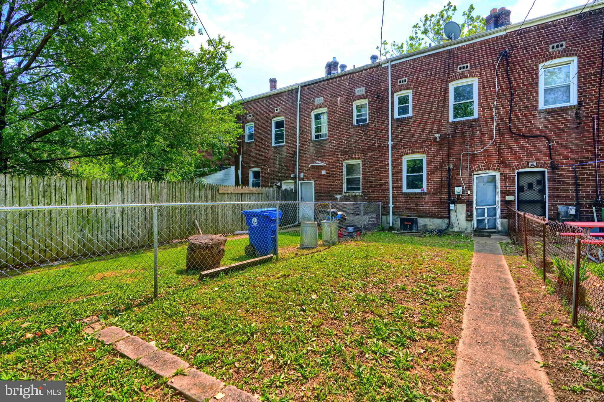 2837 Round Road Baltimore, MD 21225 - Photo 18 of 18 a backyard of a house with barbeque oven