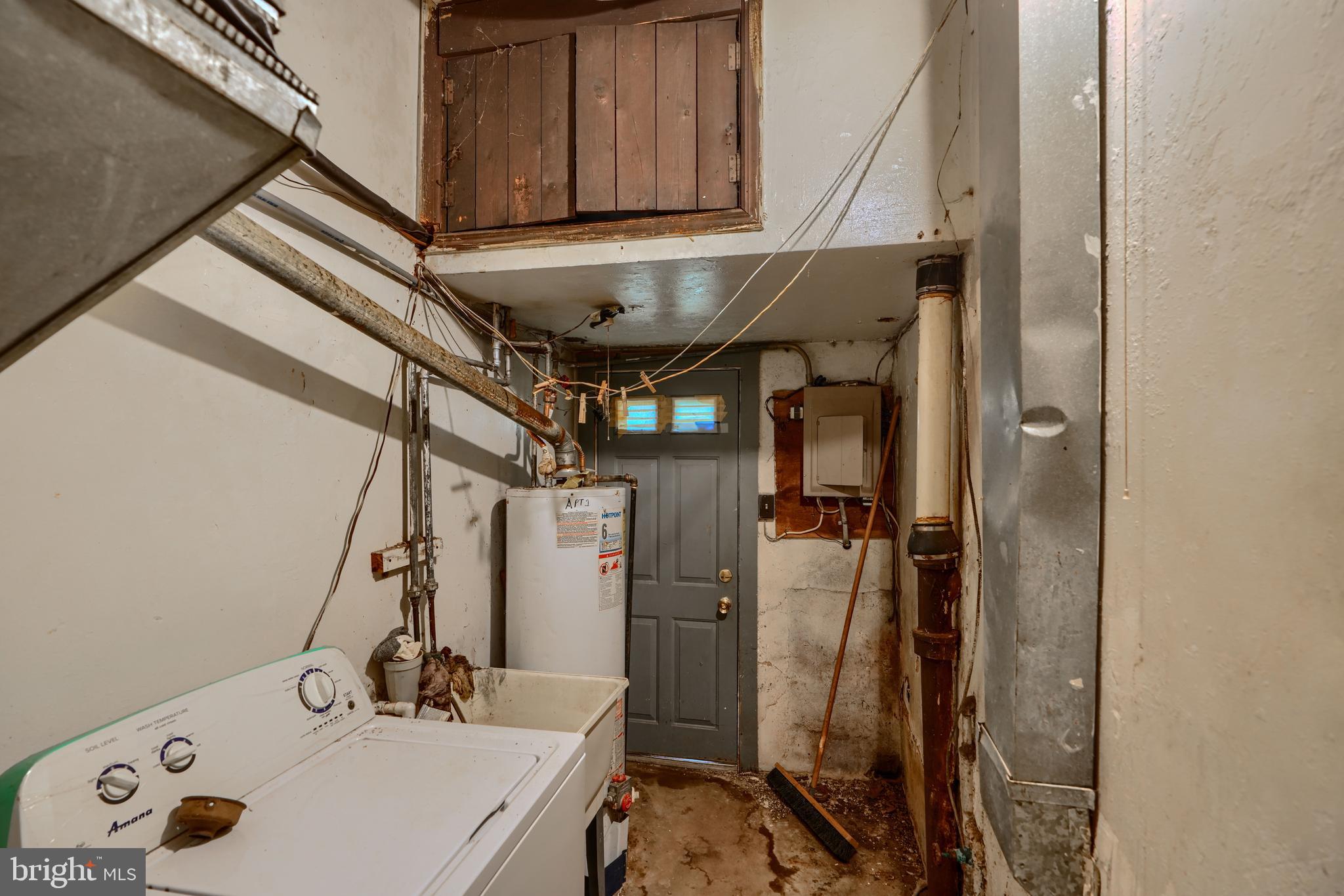 2837 Round Road Baltimore, MD 21225 - Photo 7 of 18 a bathroom with a sink and shower