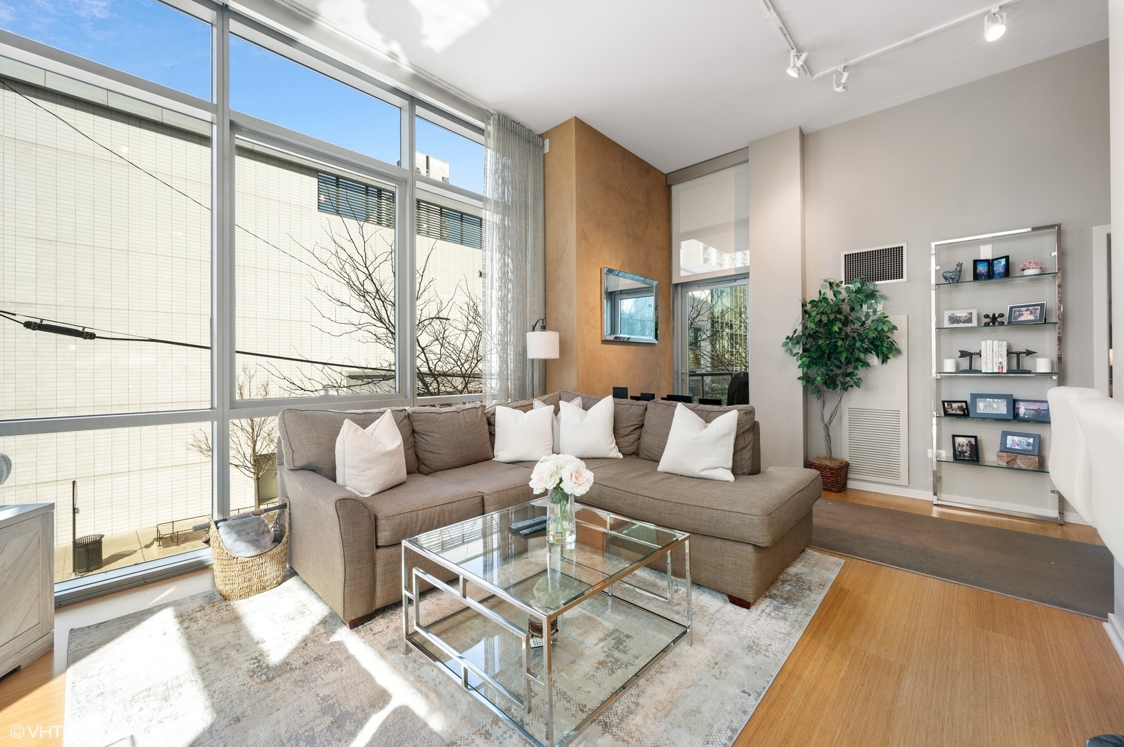 123 South Green Street, Unit 201B Chicago, IL 60607 - Photo 5 of 19 a living room with furniture large window and wooden floor