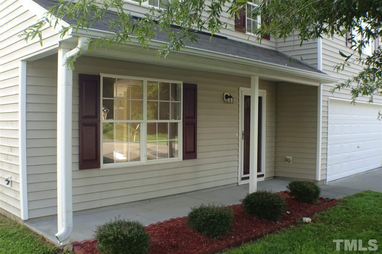 3813 Tyler Bluff Lane Raleigh, NC 27616 - Photo 2 of 25 a front view of a house with a yard