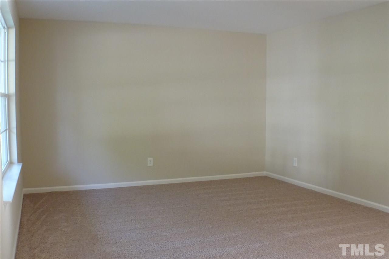 3813 Tyler Bluff Lane Raleigh, NC 27616 - Photo 11 of 25 a room that has a window in it