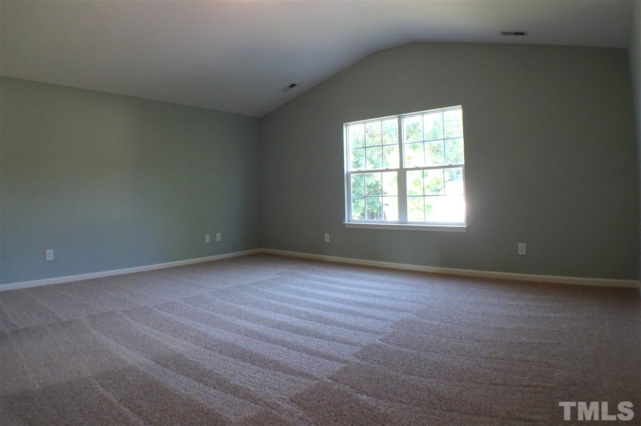 3813 Tyler Bluff Lane Raleigh, NC 27616 - Photo 13 of 25 an empty room with a window