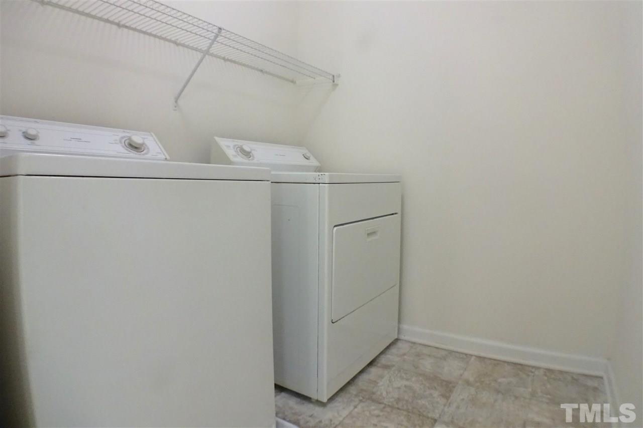 3813 Tyler Bluff Lane Raleigh, NC 27616 - Photo 22 of 25 a utility room with dryer and washer